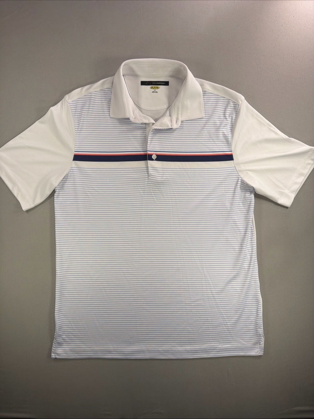 Greg Norman Collection White Polo with Navy and Red Chest Stripes